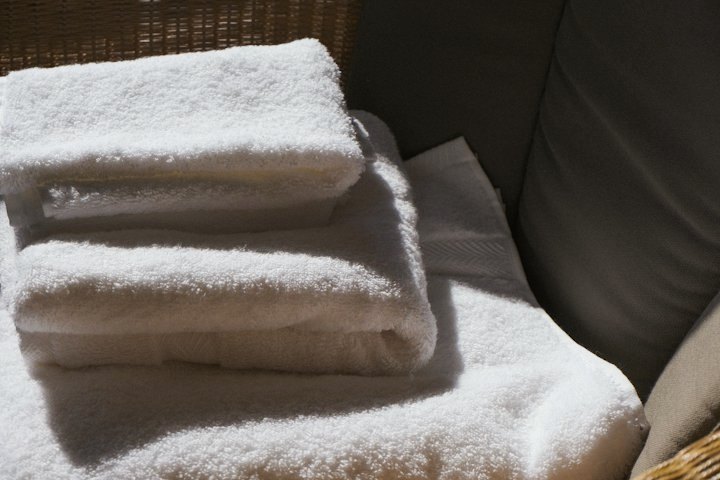 Folded white towels ready for an appointment